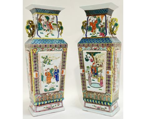 A large pair of Chinese polychrome enamel painted porcelain twin-handled vases, each of tapering squared form, painted with f
