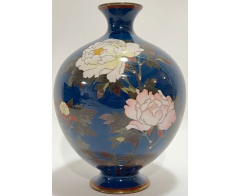 A 'Golden Age' Meiji period Japanese cloisonne enamel vase depicting peonies in fine bokashi enamels against a dark blue grou