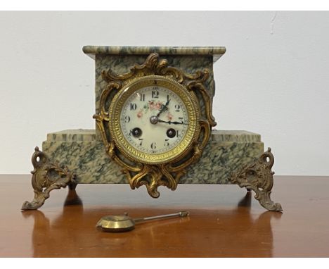 A late 19th century French green serpentine marble mantel clock, with white Ivorine dial, stepped case with floral cast gilt 