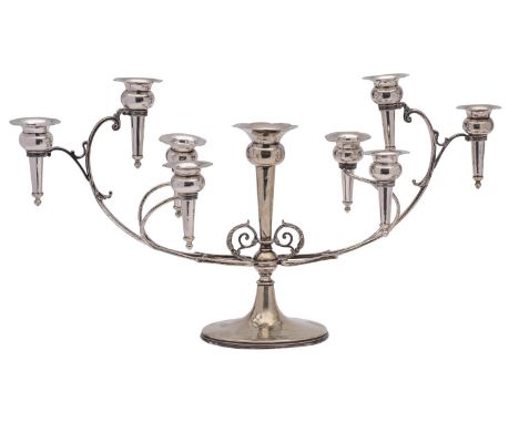 A silver plated six-branch epergne inscribed, the swept branches with tapering vases issuing from a central stem with acanthu