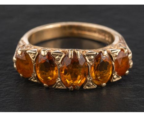 A 9ct gold, mixed-cut oval citrine five-stone ring, total estimated citrine weight ca. 2.25ct, with indistinct hallmarks for 