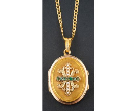 An emerald and seed pearl oval, locket pendant, with fleur-de-lys design to front, with French control marks for 18ct gold, t