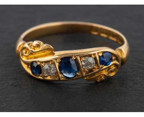 An Edwardian, 18ct gold, old-cut diamond and sapphire five-stone ring, total estimated diamond weight ca. 0.10ct, with hallma