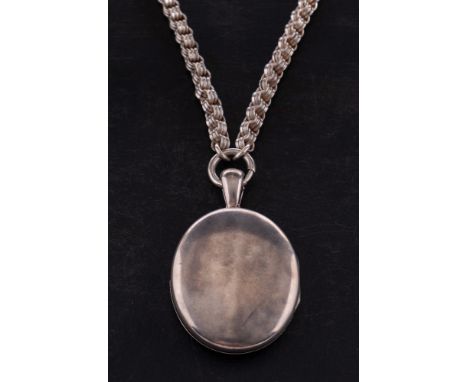 An oval locket pendant with hairwork on a fancy-link chain, length of locket (inc. bale), ca. 6cm, length of chain ca. 47.5cm