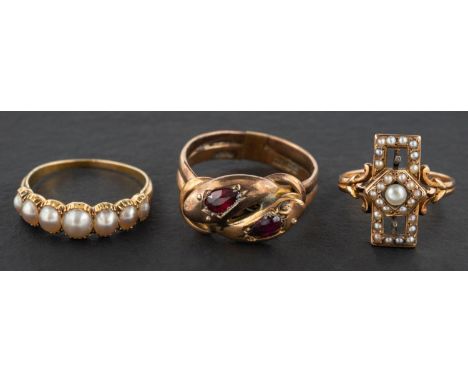 Three rings, including a 9ct gold, garnet double ouroboros ring, with hallmarks for Birmingham 1906, length of ring head ca.1