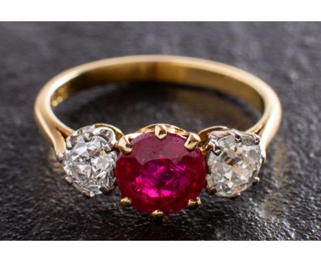 A ruby and old-cut diamond three-stone ring, estimated ruby weight ca. 1.30ct, total estimated diamond weight ca. 1.25cts, I-