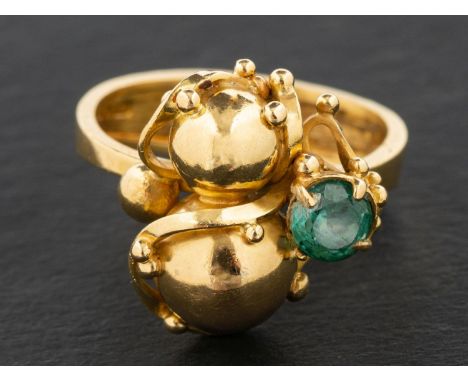 An 18ct gold, round, mixed-cut green tourmaline ring, in the form of a gourd entwined by tendrils, estimated tourmaline weigh