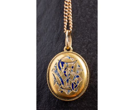 An oval, locket pendant, with blue enamel monogram 'TS', to front and motto 'Dum Spiro Spero' to verso, with glazed inner com