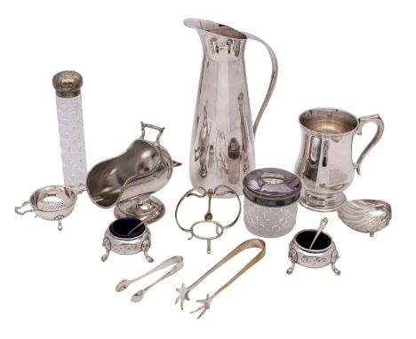 A collection of assorted plated wares includes, water jug, mug, a pair of cauldron salts, tea strainer, sugar basin etc.