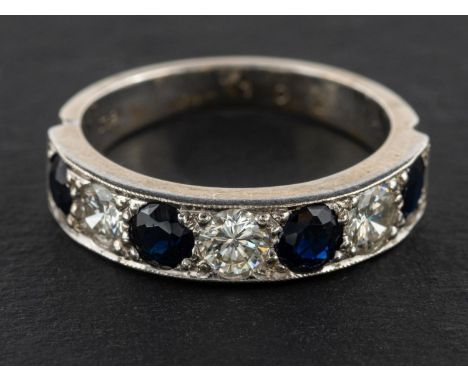 A sapphire and round, brilliant-cut diamond half-eternity ring, total estimated diamond weight ca. 0.75ct, G-H colour, VS2-SI