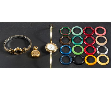 Three gilt metal dress watches, including a Gucci wristwatch with 16 vari-coloured plastic, removable, bezels and original fi