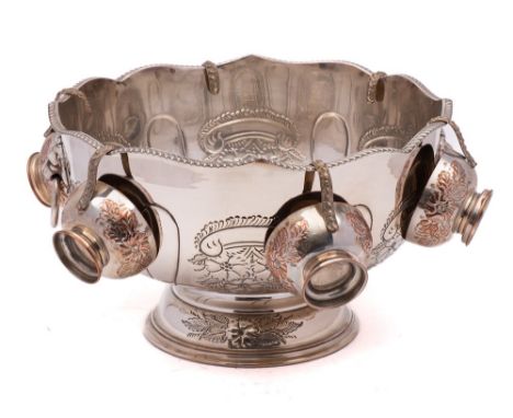 A 20th century silver plated pedestal  punch bowl of circular outline with gadrooned border, incised foliate and scroll decor