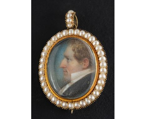 An early 19th century portrait miniature pendant/ brooch, watercolour on ivory, depicting a gentleman in profile, with seed p