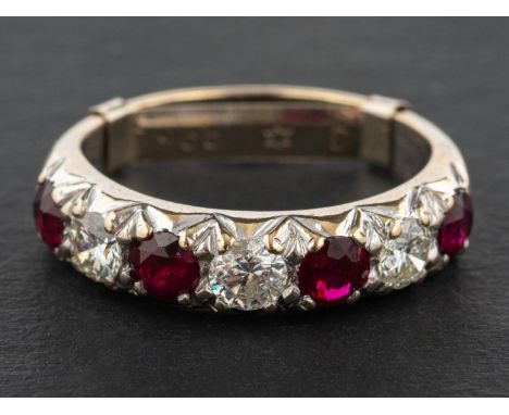 A ruby and round, brilliant-cut diamond half-eternity ring, total estimated diamond weight ca. 0.60ct, G-H colour, SI1-2 clar