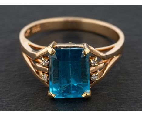 An octagonal step-cut blue topaz ring, estimated blue topaz weight ca. 2.90ct, the topaz probably flanked by four diamonds, s