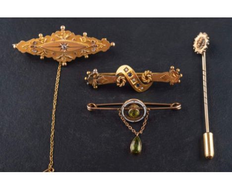 Three brooches and a tiepin, including a 9ct gold brooch set with a rose-cut diamond, 0.01ct, Chester; a peridot and white en
