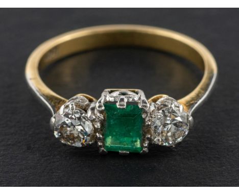 A rectangular, step-cut emerald and old-cut diamond, three-stone ring, estimated emerald weight ca. 0.45ct, total estimated d