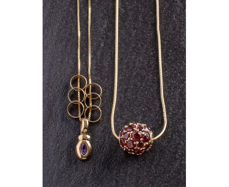 Two gemset pendants, including a spherical garnet set pendant, stamped '14K', diameter ca. 1.4cm; and an oval, mixed-cut amet
