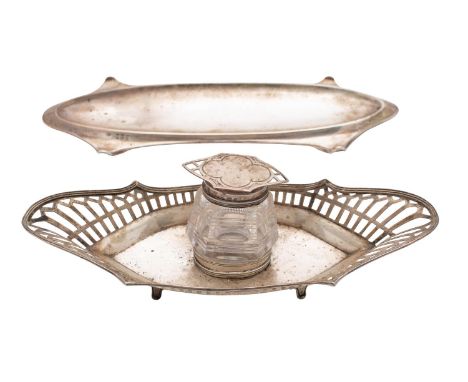 A George V silver pen tray, maker's mark worn, Birmingham, 1912 of oval outline, 23cm wide, together with a silver inkwell an