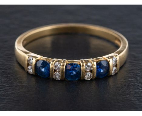 An 18ct gold, sapphire and round, brilliant-cut diamond, half-eternity ring, estimated total sapphire weight ca. 0.45cts, est