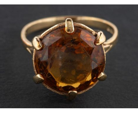 A 1960's, 9ct gold, round, mixed-cut citrine ring,  estimated citrine weight ca. 8cts, with hallmarks for London, 1969, lengt