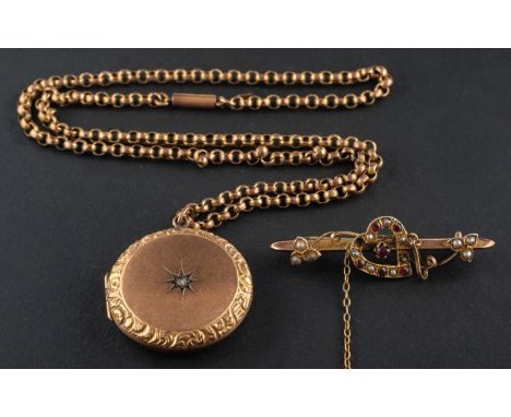 A 9ct gold, Edwardian, ruby and seed pearl 'witches heart' bar brooch and a circular, rose-cut diamond, locket pendant, the l