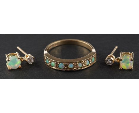 A 9ct gold, cabochon-cut opal, half-eternity ring, length of ring head ca. 1.5cm, ring size N, together with a pair of opal a