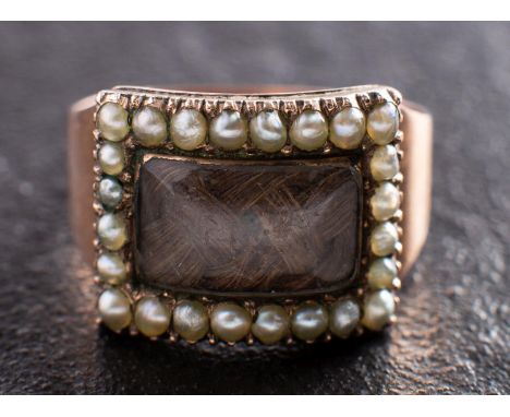 A Georgian mourning ring, the hairwork centrepiece with seed pearl surround, inscription to verso 'Mary Blurton Obt 18 April 