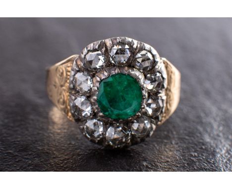 A 19th century foil backed, round, mixed-cut emerald and rose-cut diamond cluster ring, total estimated diamond weight ca. 0.