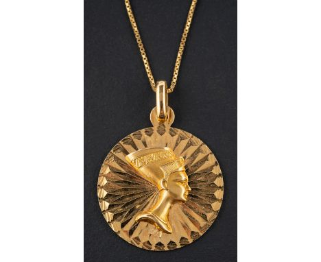 A medallion pendant, depicting Nefertiti's profile in relief, stamped '750', together with a box-link chain, stamped '750', l