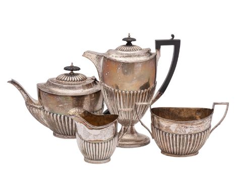 A George V silver three-piece tea service, maker William Aitken, Birmingham, 1913 of ovoid form with half-reeded decoration, 