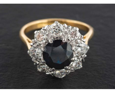 An 18ct gold, sapphire and round, brilliant-cut diamond cluster ring,: estimated sapphire weight ca. 2.10ct, estimated total 
