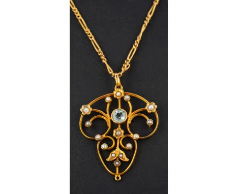 An openwork, aquamarine and seed pearl pendant, estimated aquamarine weight ca. 0.45ct, stamped '9CT', together with a figaro