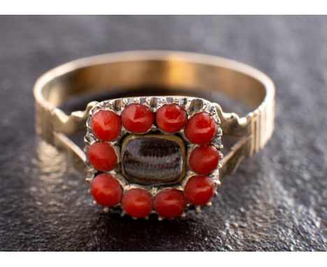 An early 19th century sentimental ring, the hairwork centrepiece with beaded coral surround, length of ring head ca. 1.1cm, r