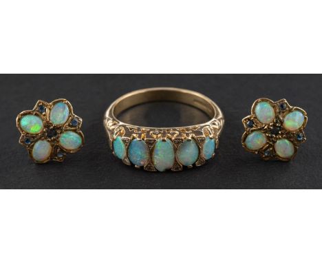 A 9ct gold, cabochon-cut opal five-stone ring with single-cut diamond spacers and hallmarks for London, 2006, ring size N1/2,