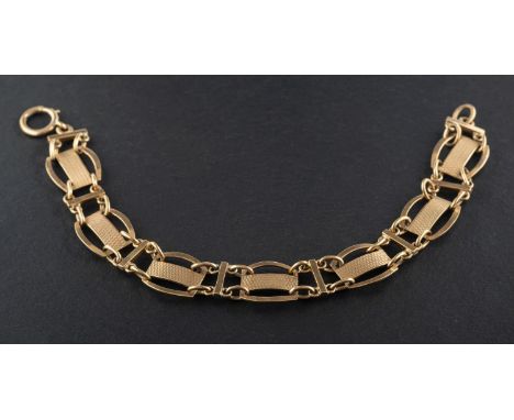 A fancy-link bracelet, with engine-turned decoration, stamped '9CT', total length ca. 18.5cm, total weight ca. 10.7gms. 