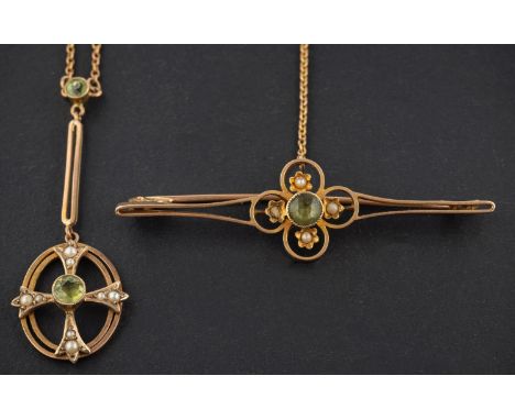 An openwork peridot and seed pearl brooch and pendant, the brooch stamped '15CT', the pendant '9CT', length of brooch ca. 5.8