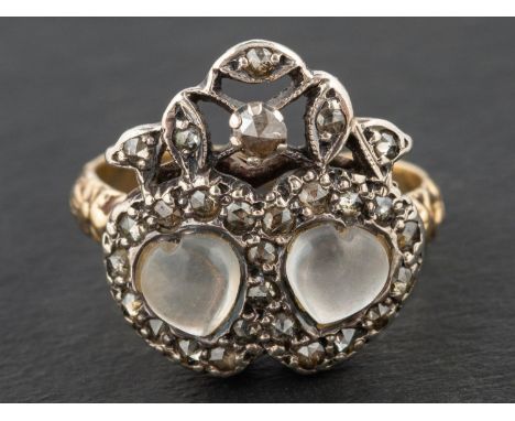 A 19th century, 'Luckenbooth' ring, depicting two cabochon-cut moonstone hearts entwined, bordered by rose-cut diamonds, surm