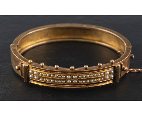 A Victorian Etruscan Revival seed pearl hinged bangle, inner length ca. 5.8cm, total weight ca. 17gms.