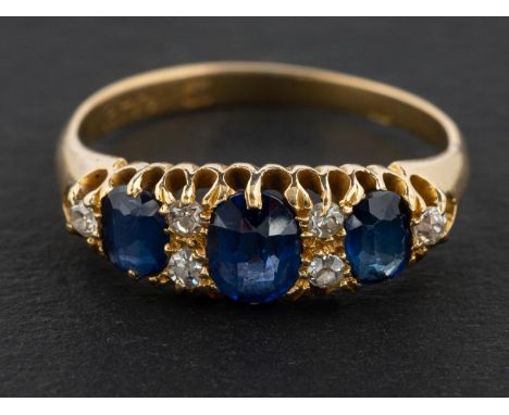 A cushion-cut sapphire, three-stone ring, with single-cut diamond spacers, total estimated sapphire weight ca. 1.35ct, total 