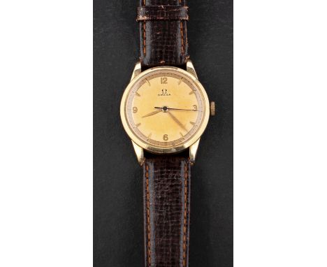 Omega, a gentleman's' gold plated wristwatch the gold colour dial with baton numerals with Arabic 12, 3, 6 &amp; 9  positions