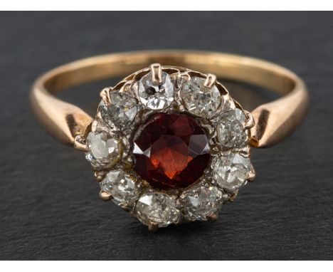 A garnet and old-cut diamond cluster ring, estimated garnet weight ca. 0.75ct, total estimated diamond weight ca. 0.45ct, H-I