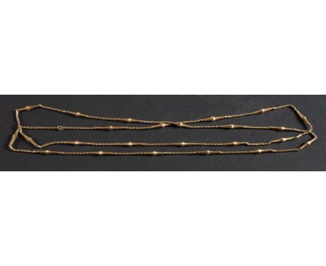 A fancy-link chain, with foliate engraved elongated hexagonal pyramid spacers, total length ca. 134cm, total weight ca. 29gms