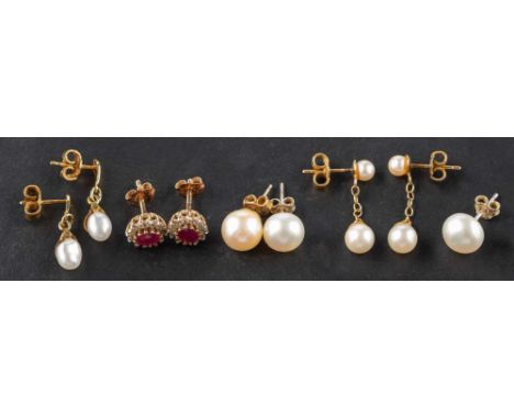 Four pairs of earrings and an ear stud, including a pair of ruby and diamond cluster earrings, estimated diamond weight ca. 0