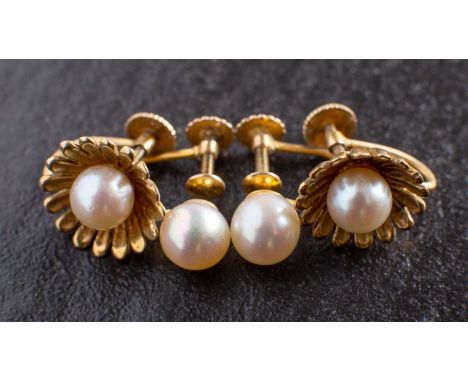 Two pairs of cultured pearl ear clips, including a 9ct gold pair of flowerhead design, diameter of cultured pearls ca. 5.9mms
