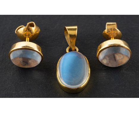 An oval, cabochon-cut moonstone pendant and pair of ear studs, the ear studs with post fittings, length of pendant (exl jump 