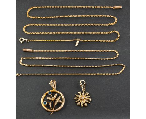 Two openwork seed pearl pendants, including a star-burst pendant, stamped '15C', and a blue paste pendant of floral design, s