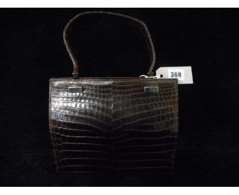 A vintage brown skin handbag retailed by Finnigan of Bond Street, London
