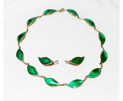 A Norwegian silver gilt necklace with green enamel leaf decoration and a pair of matching earrings