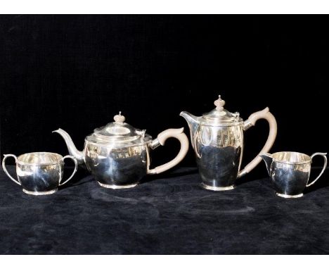 A silver four piece tea service with reeded rims comprising:- teapot, hot water jug, cream jug and double handled sucrier - L